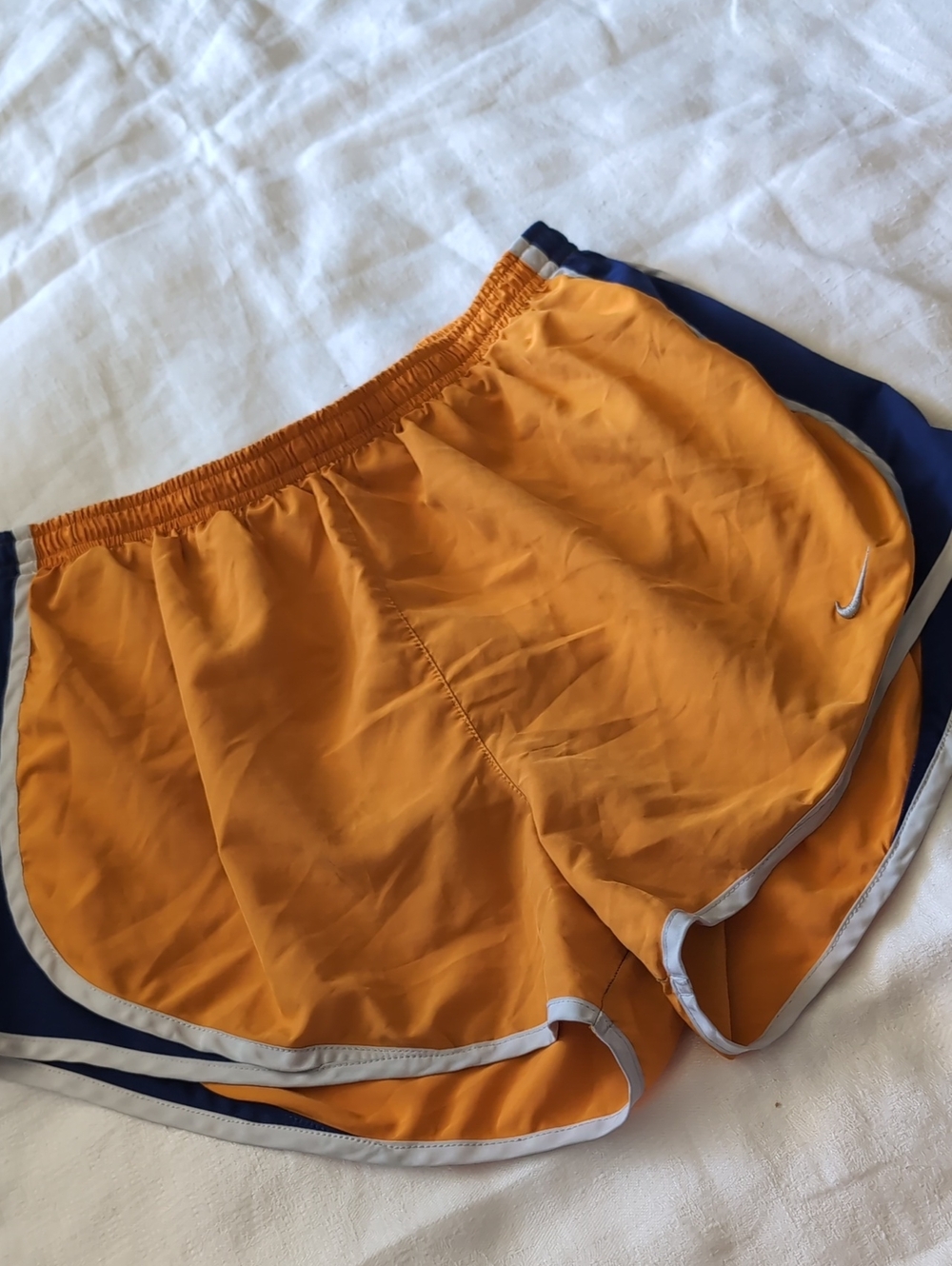 Nike Women’s Orange Running Shorts with Navy Panels and White Trim